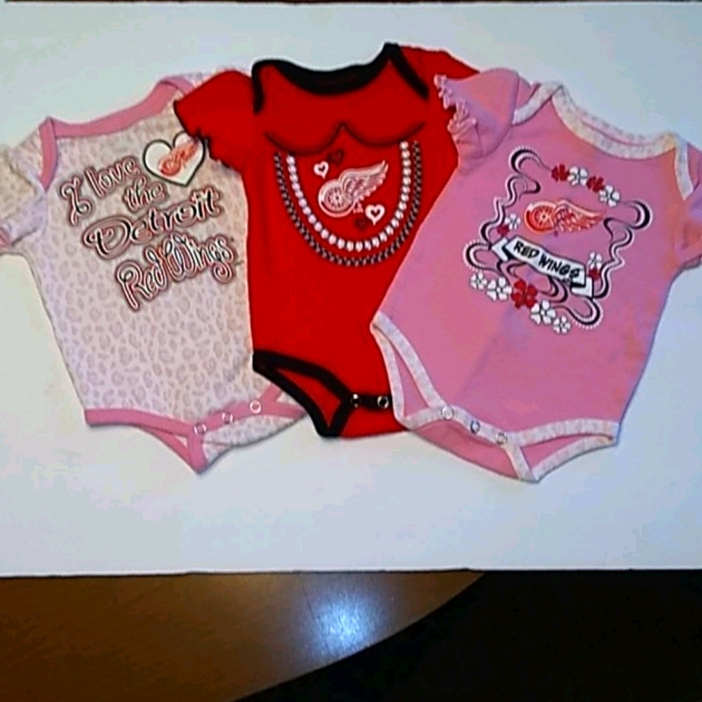 Bundle of three NHL Red Wing girls onesies.